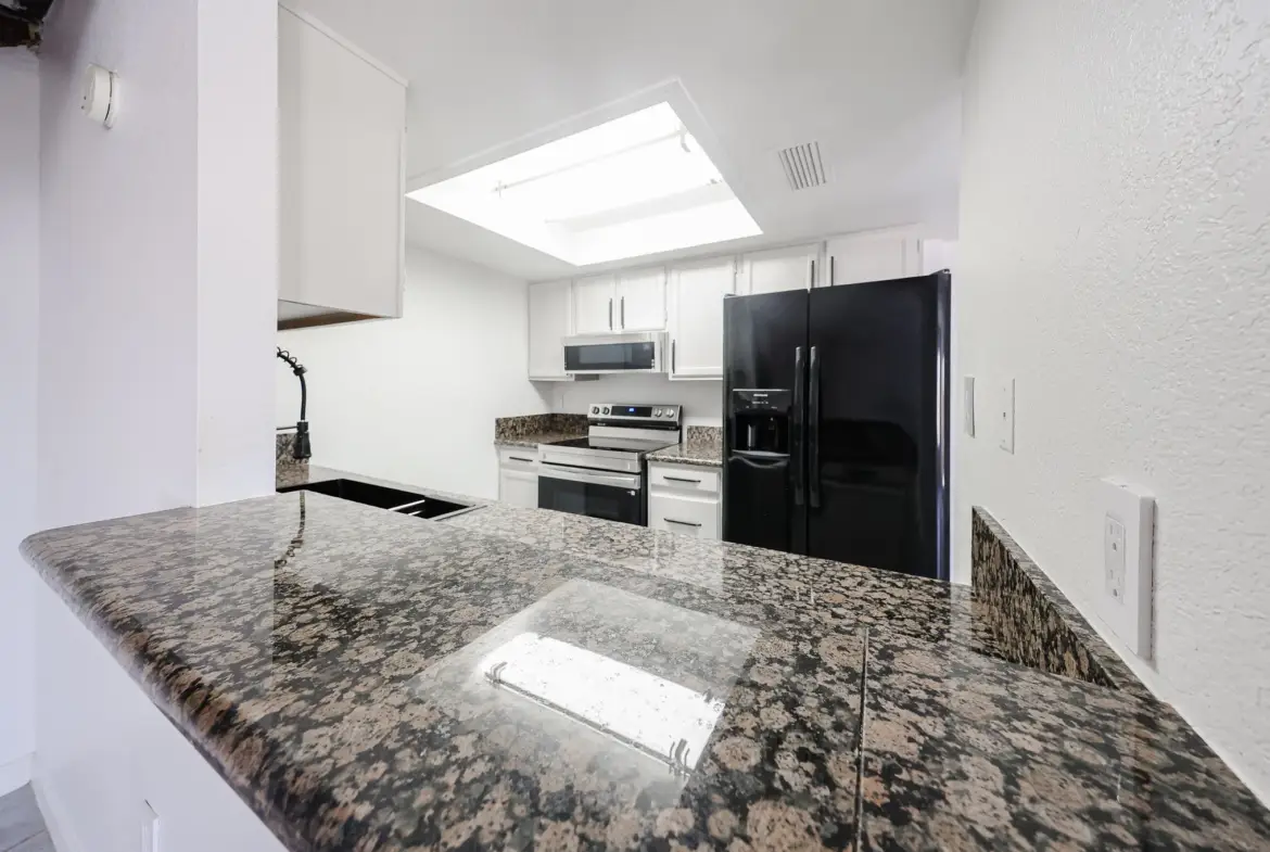 Granite breakfast bar in the updated kitchen