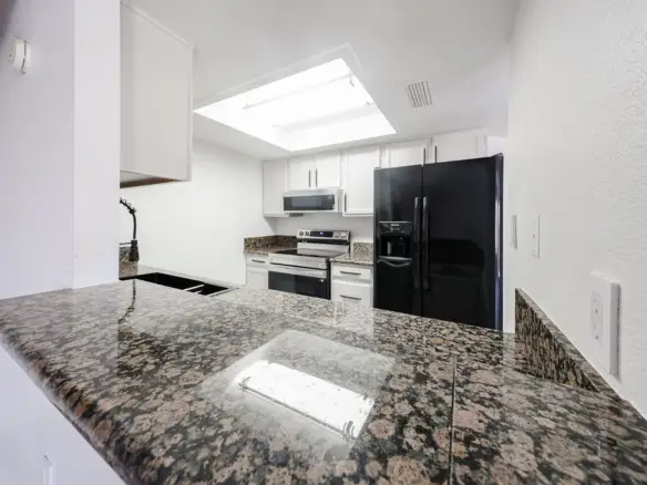 Granite breakfast bar in the updated kitchen