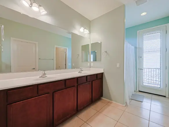 Primary bathroom with dual sinks at 17717 W Mandalay Ln