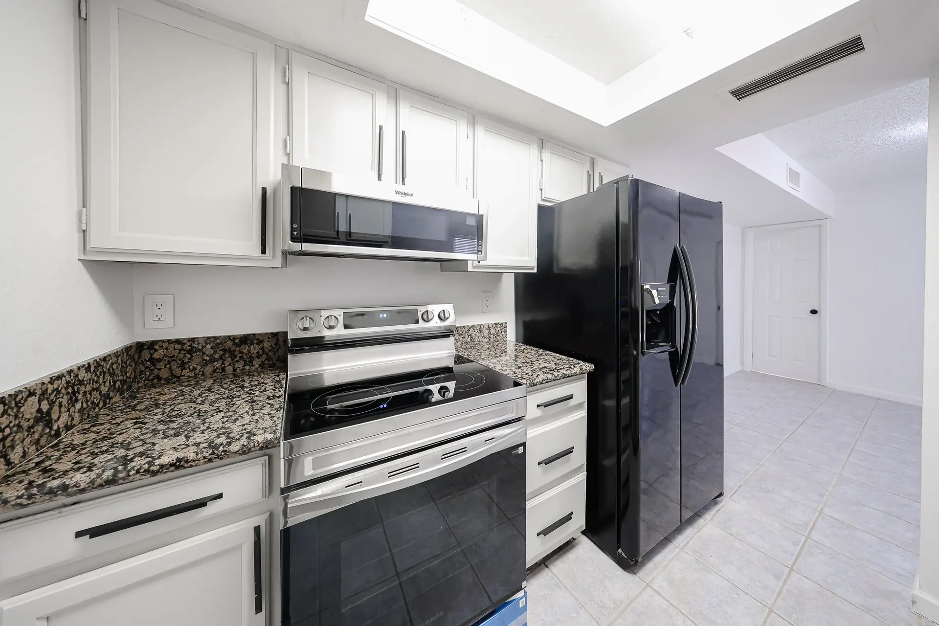 Kitchen Appliances Updated kitchen with refrigerator, range and microwave