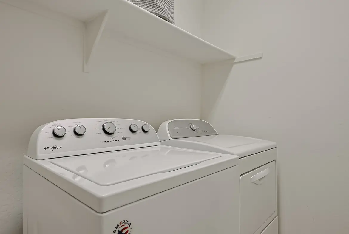 Upstairs laundry with washer and dryer at 17717 W Mandalay Ln