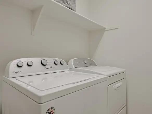 Upstairs laundry with washer and dryer at 17717 W Mandalay Ln