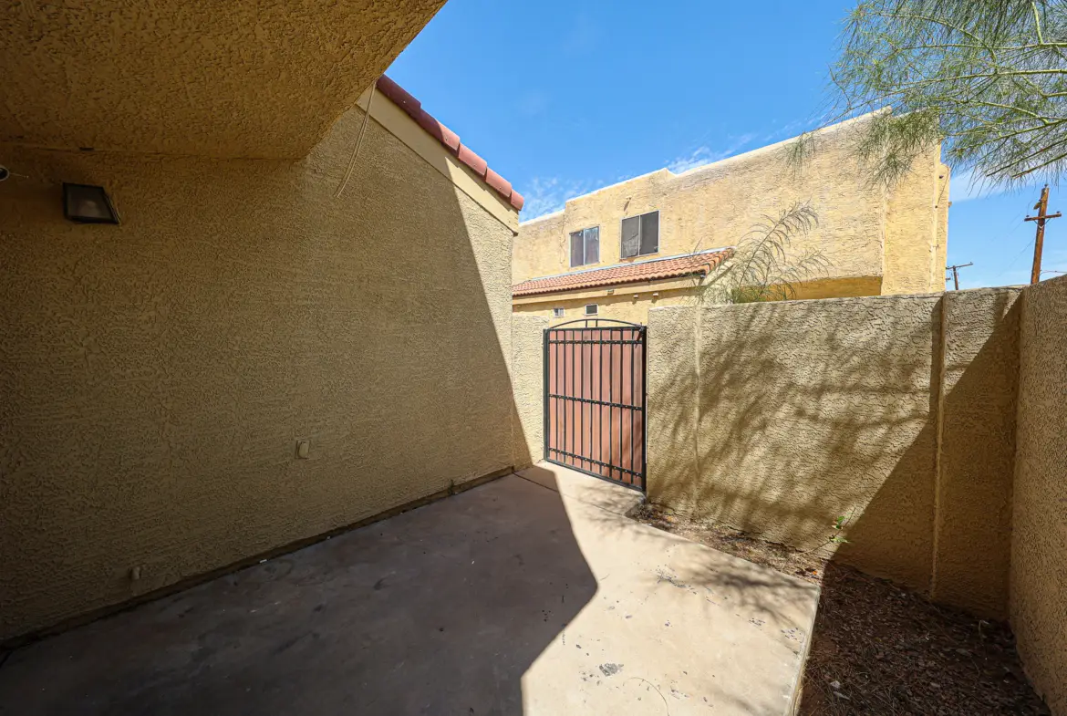 Exterior patio entry and fenced outdoor space