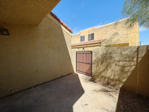 Exterior patio entry and fenced outdoor space