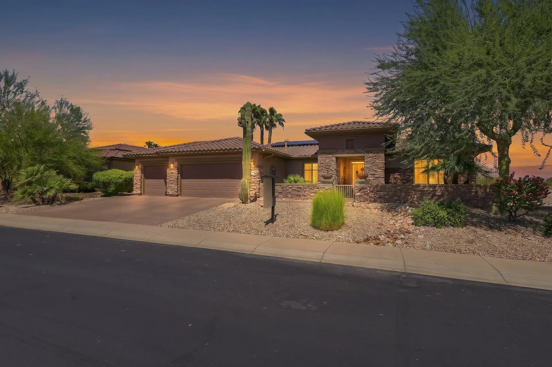 Front exterior of 16904 W Villagio Dr at twilight in Surprise, Arizona