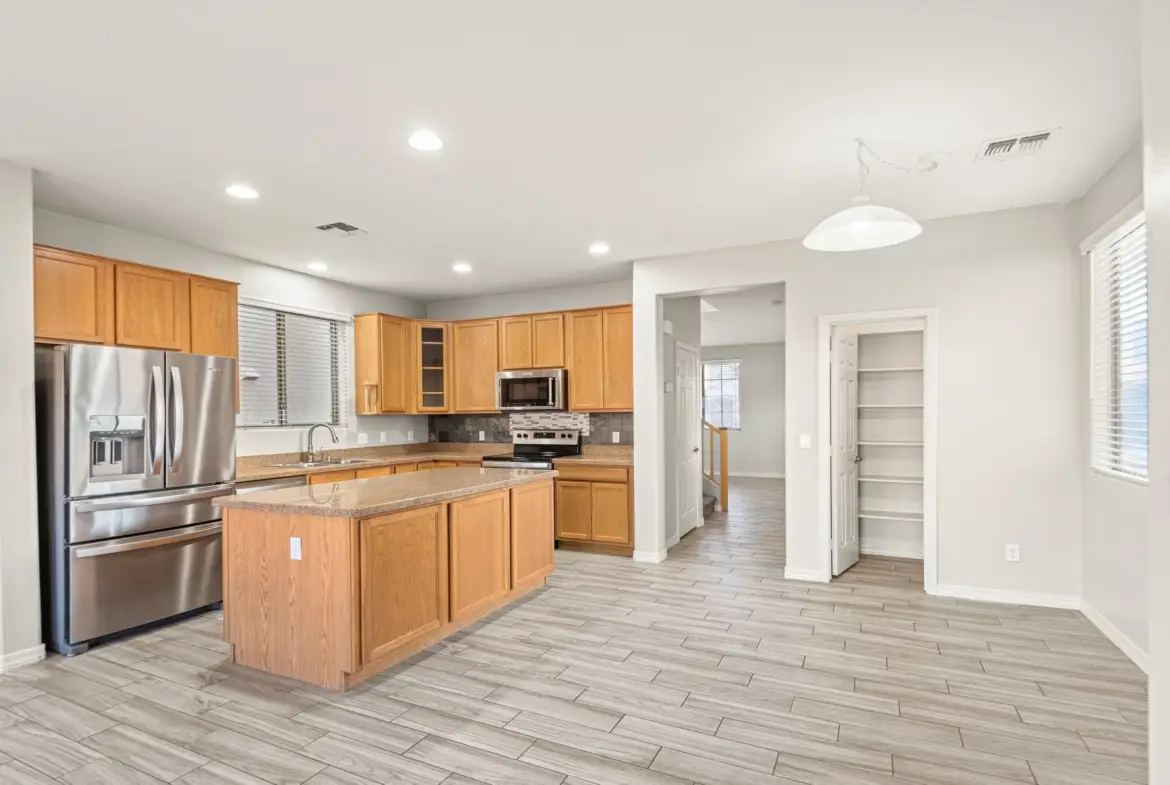Kitchen and island at 14772 W Riviera Dr in Surprise, Arizona.