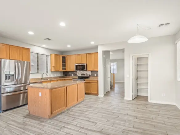 Kitchen and island at 14772 W Riviera Dr in Surprise, Arizona.