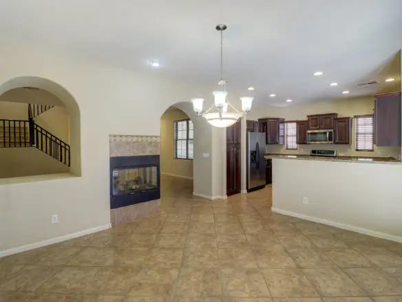 Dining room and fireplace at 15359 W Columbine Dr in Surprise, Arizona.