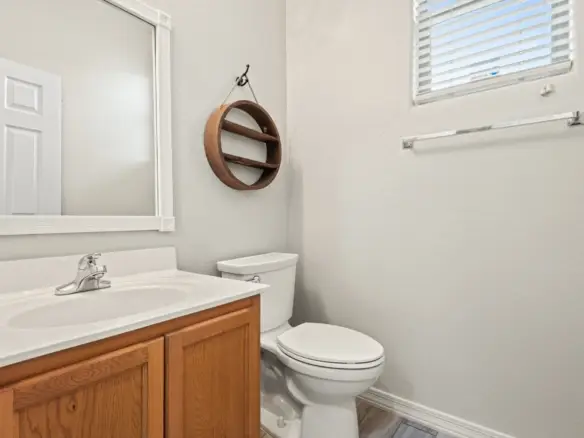 Downstairs half bath at 14772 W Riviera Dr in Surprise, Arizona.