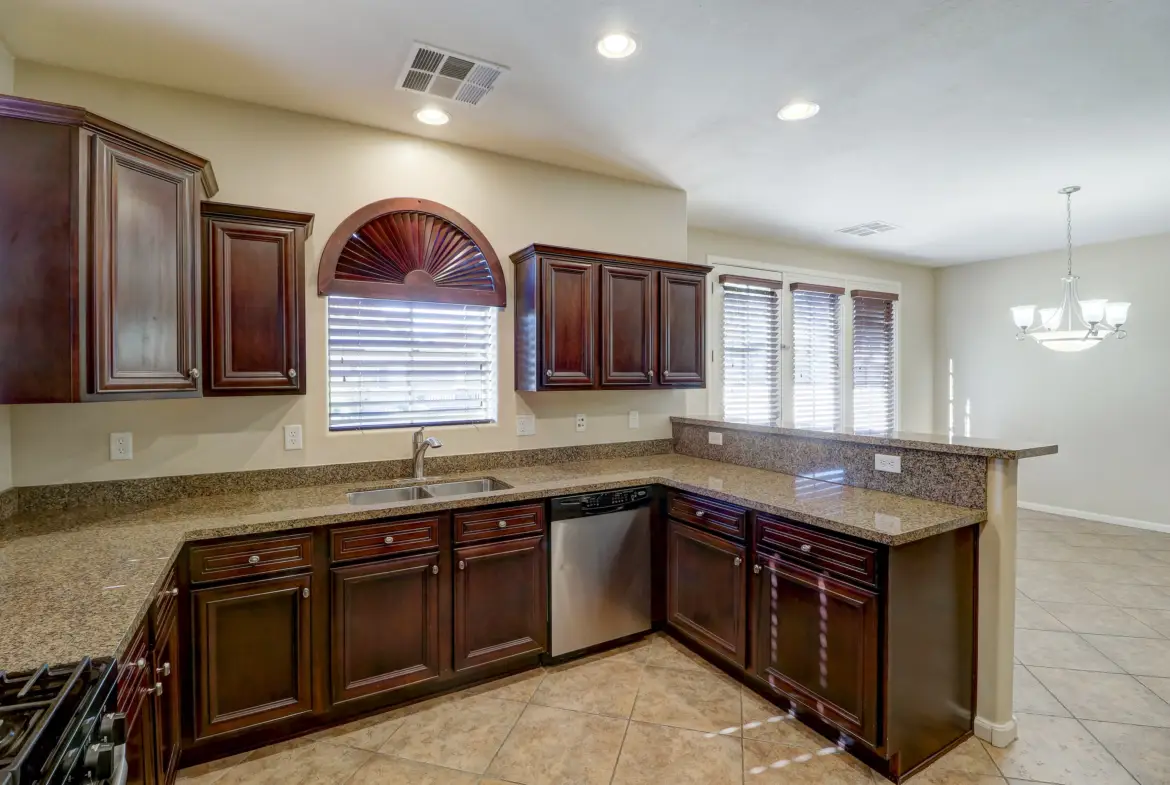 Kitchen to dining room at 15359 W Columbine Dr in Surprise, Arizona.