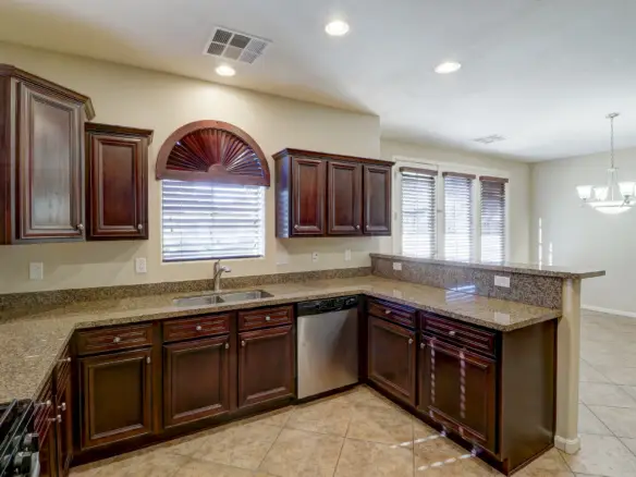 Kitchen to dining room at 15359 W Columbine Dr in Surprise, Arizona.