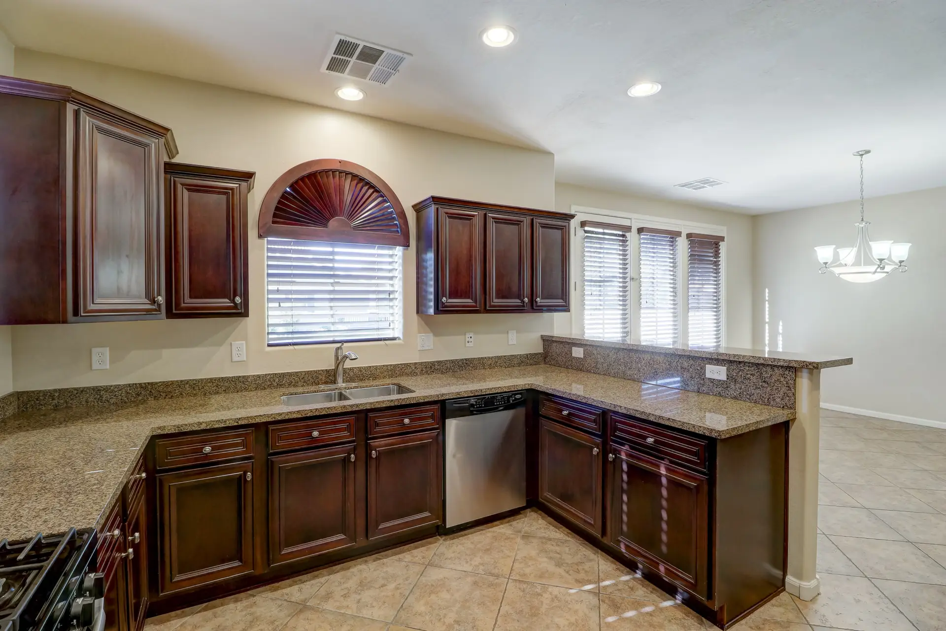 09 Kitchen to dining room | 15359 W Columbine Dr Kitchen to dining room at 15359 W Columbine Dr in Surprise, Arizona.