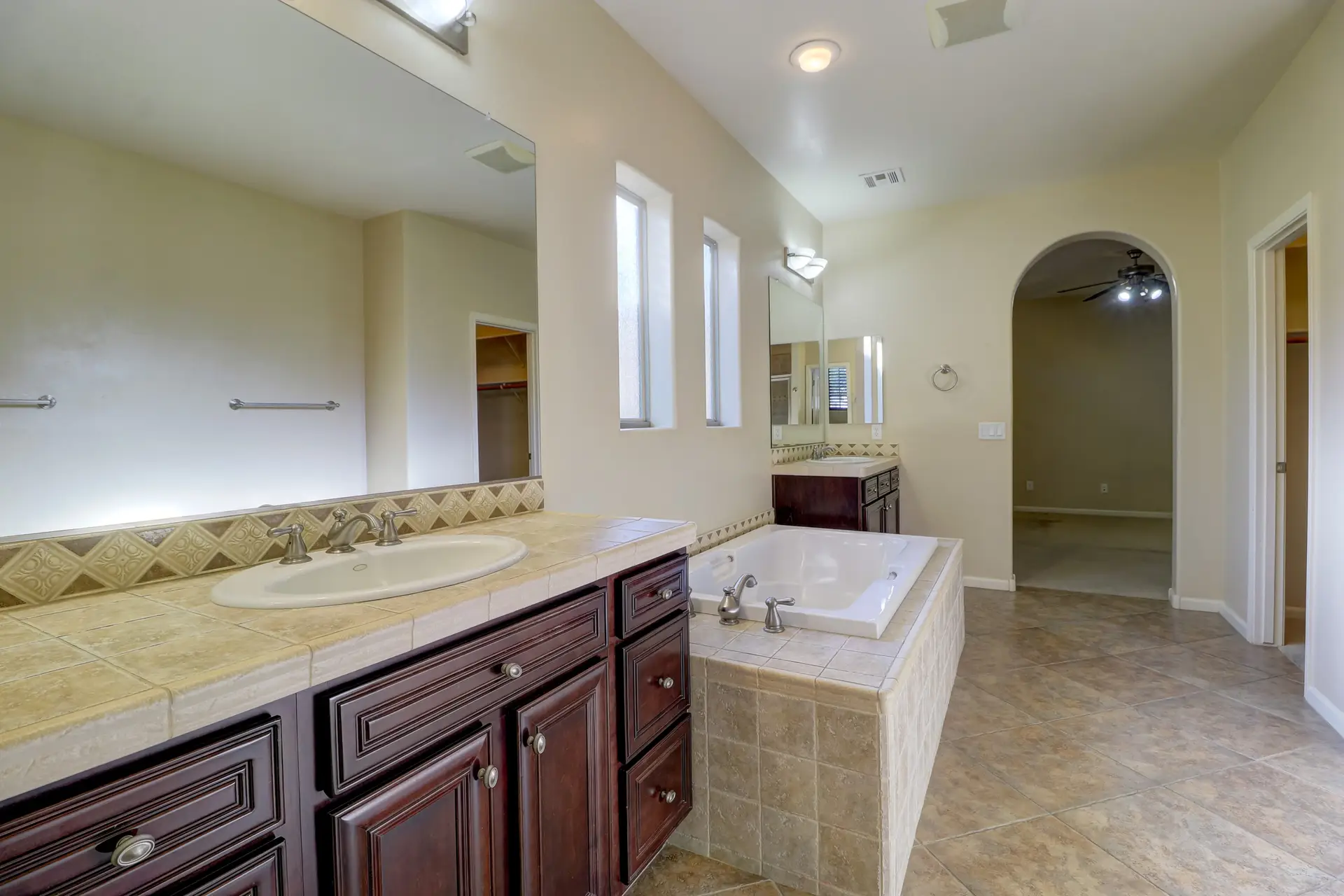 13 Primary bathroom vanity | 15359 W Columbine Dr Primary bathroom vanity at 15359 W Columbine Dr in Surprise, Arizona.