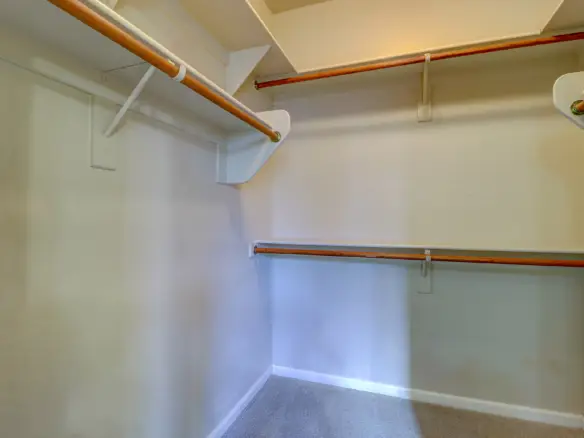 Walk in closet at 15359 W Columbine Dr in Surprise, Arizona.