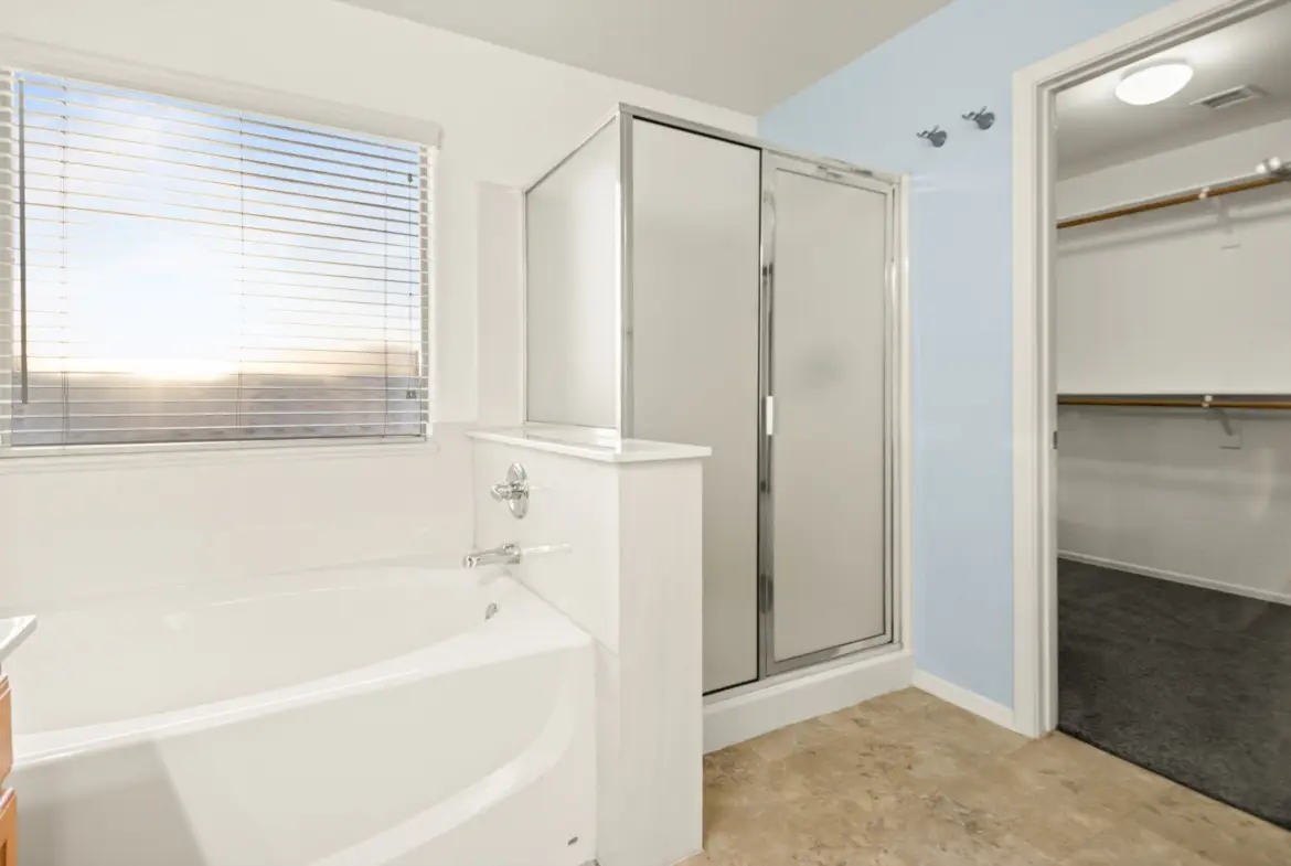 Primary tub and shower at 14772 W Riviera Dr in Surprise, Arizona.