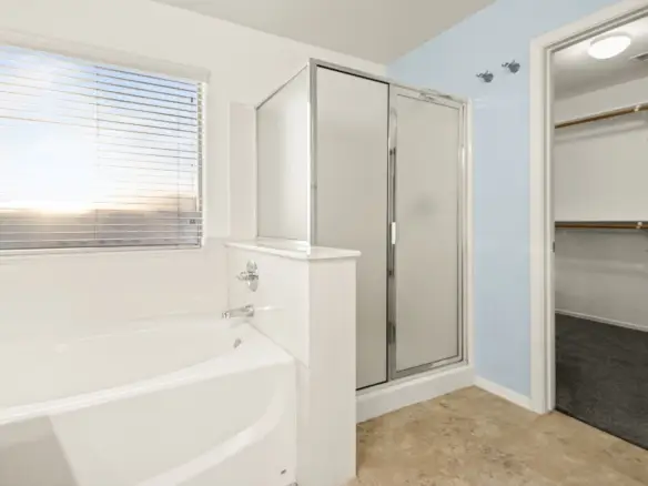 Primary tub and shower at 14772 W Riviera Dr in Surprise, Arizona.