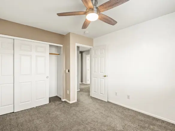 Bedroom three closet at 14772 W Riviera Dr in Surprise, Arizona.