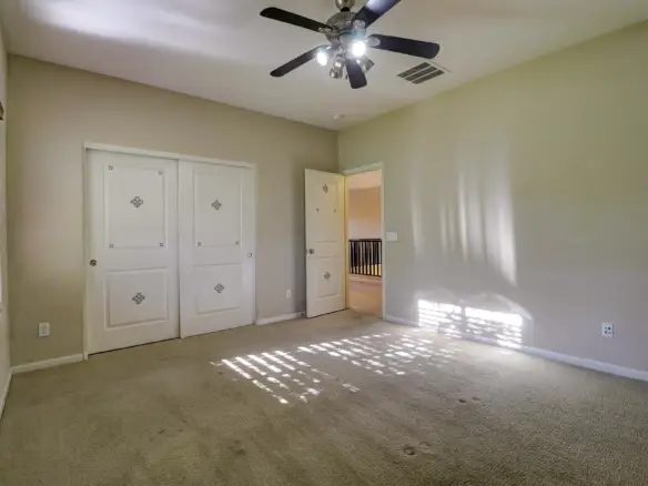 Bedroom two closet at 15359 W Columbine Dr in Surprise, Arizona.