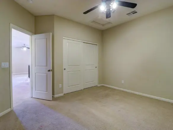 Bedroom three closet at 15359 W Columbine Dr in Surprise, Arizona.
