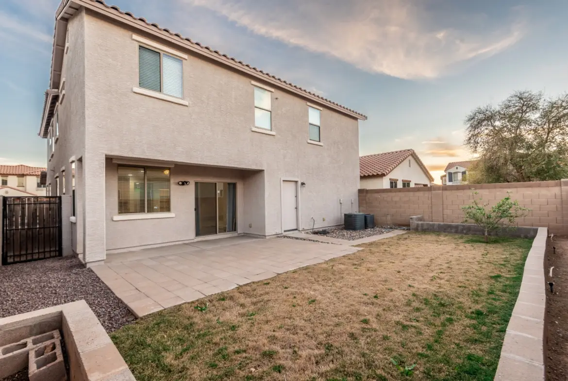 Covered patio and backyard at 14772 W Riviera Dr in Surprise, Arizona.