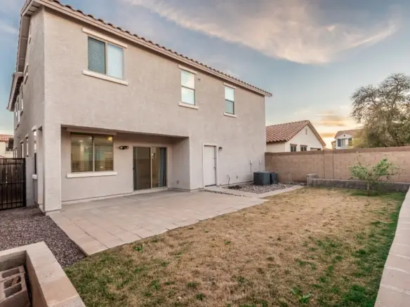 Covered patio and backyard at 14772 W Riviera Dr in Surprise, Arizona.