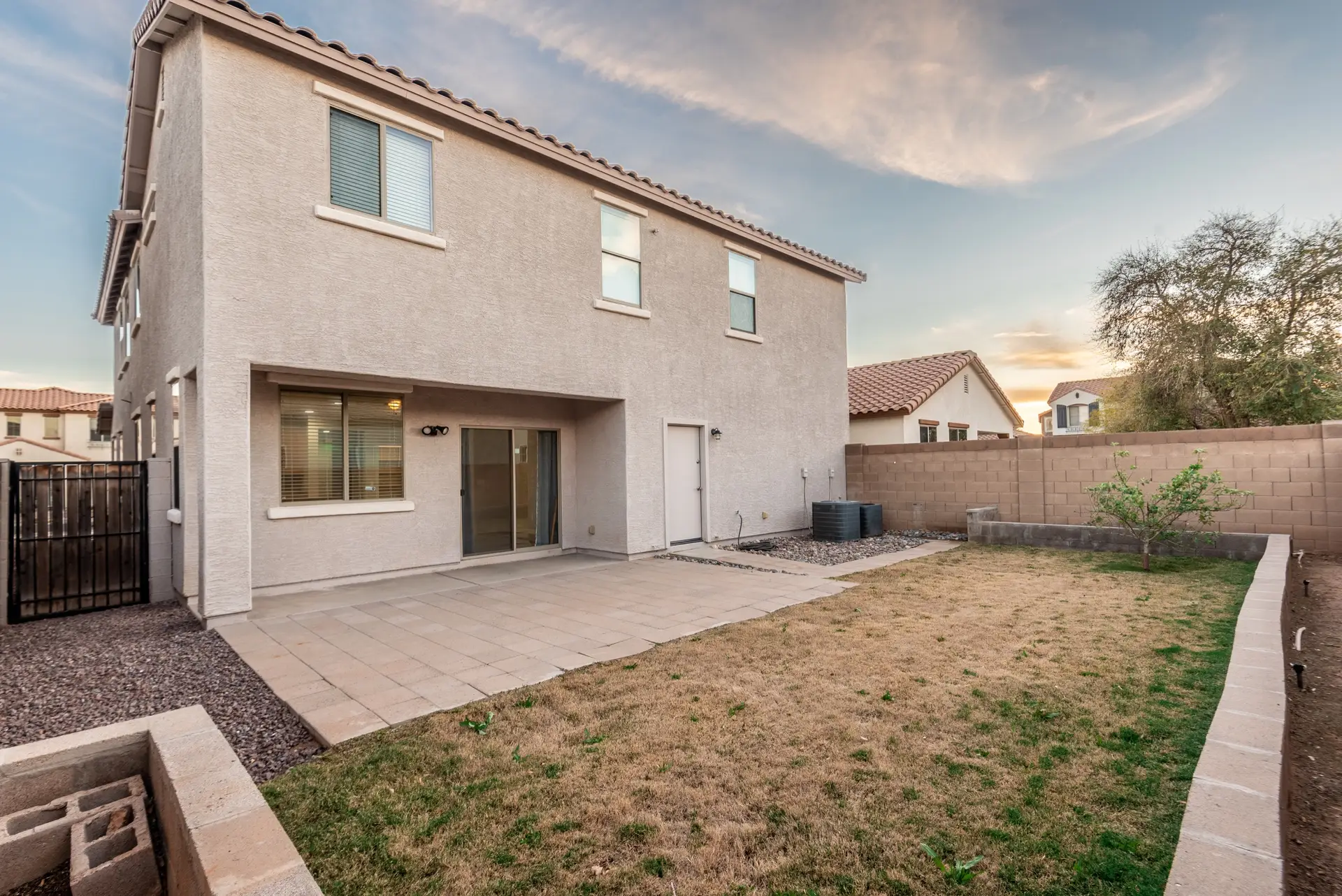 24 Covered patio and backyard | 14772 W Riviera Dr Covered patio and backyard at 14772 W Riviera Dr in Surprise, Arizona.