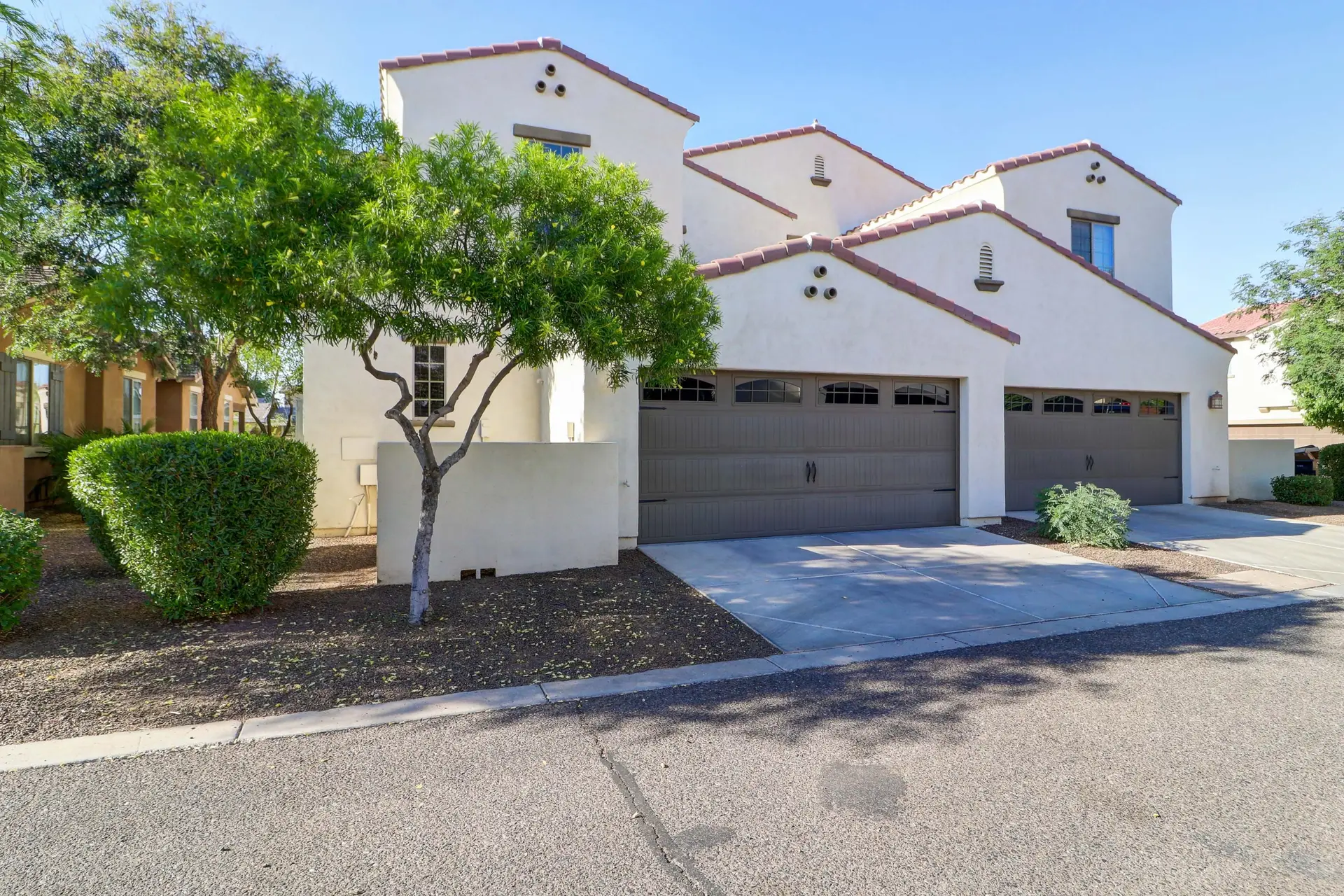 29 Garage and driveway | 15359 W Columbine Dr Garage and driveway at 15359 W Columbine Dr in Surprise, Arizona.