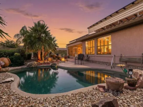 Villagio backyard and pool photographed at twilight